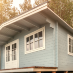 A duck egg blue granny flat with white roof and window trim. A wooden deck out the front. Depreciation can be claimed on the granny flat as it is used as an investment property.