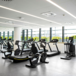 A gym in an apartment complex with rows of treadmills. Apartments can also have significant Capital Works deductions; they often have underground parking, gyms and pools and fancy roof top areas with BBQs. 