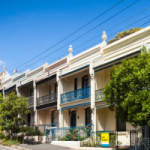 A row of terrace houses in Sydney, one with a for lease sign. Even older investment properties will have renovations where depreciation can be claimed. It's always worth asking the question.