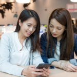 A friend shows their friend the Depreciator website on their phone. Refer your friend to Depreciator and earn a $40 gift card once their Depreciation Schedule is complete.