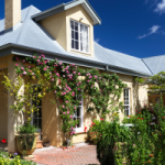 An older property with a bay window in the second story and a chimney in the roof. Older investment properties have usually been renovated, and you can claim depreciation on those renovations.