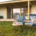 Two lounge chairs outside an Airbnb house on the lawn as the sunsets. Owners of properties listed on Airbnb were notified a couple of years ago that that income data was being passed onto the ATO.